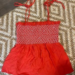 Orange with white stitching tie top